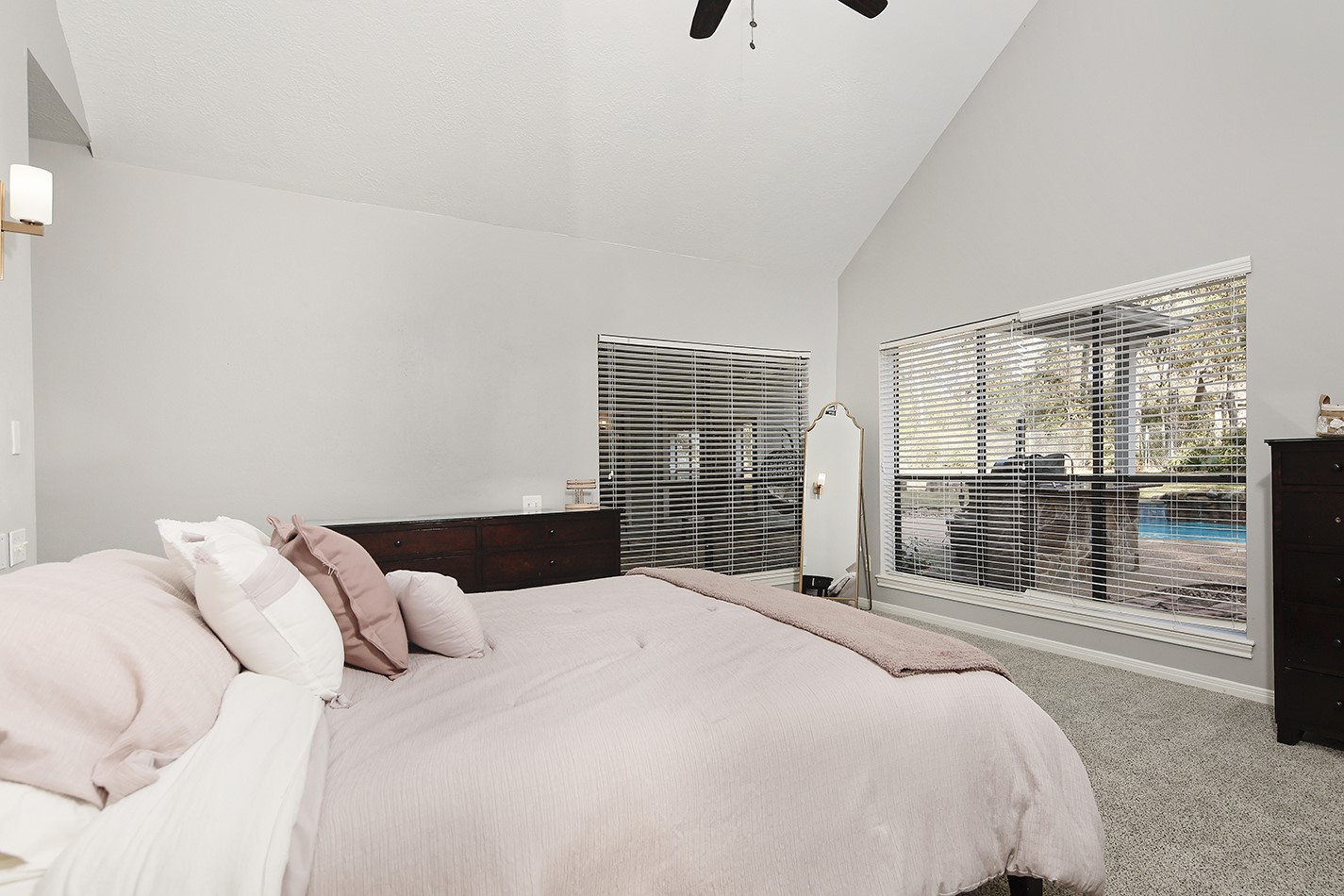 44 Lake Forest Circle Conroe, TX 77384 - Photo 23 of 45 a bedroom with a large bed and a large window