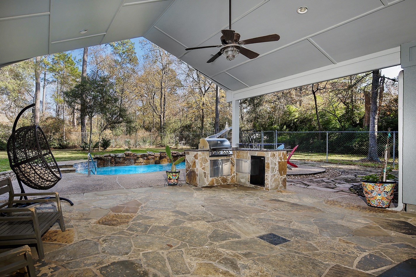 44 Lake Forest Circle Conroe, TX 77384 - Photo 27 of 45 a view of a porch with furniture and garden