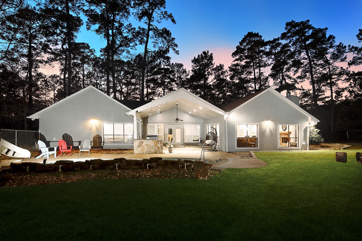 44 Lake Forest Circle Conroe, TX 77384 - Photo 39 of 45 a front view of a house with a garden and trees