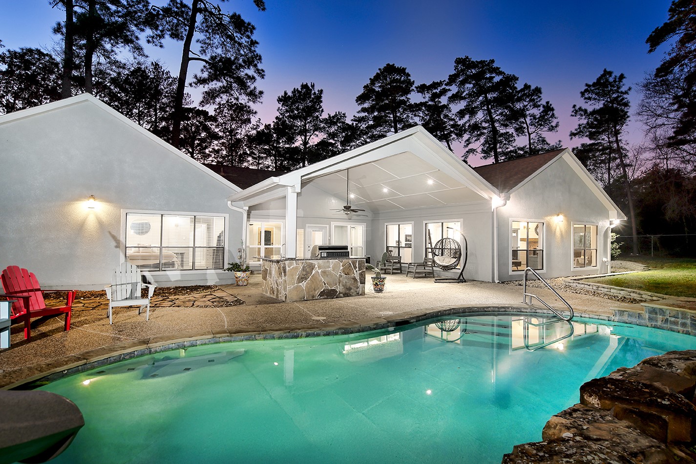 44 Lake Forest Circle Conroe, TX 77384 - Photo 40 of 45 a view of a house with swimming pool and sitting area