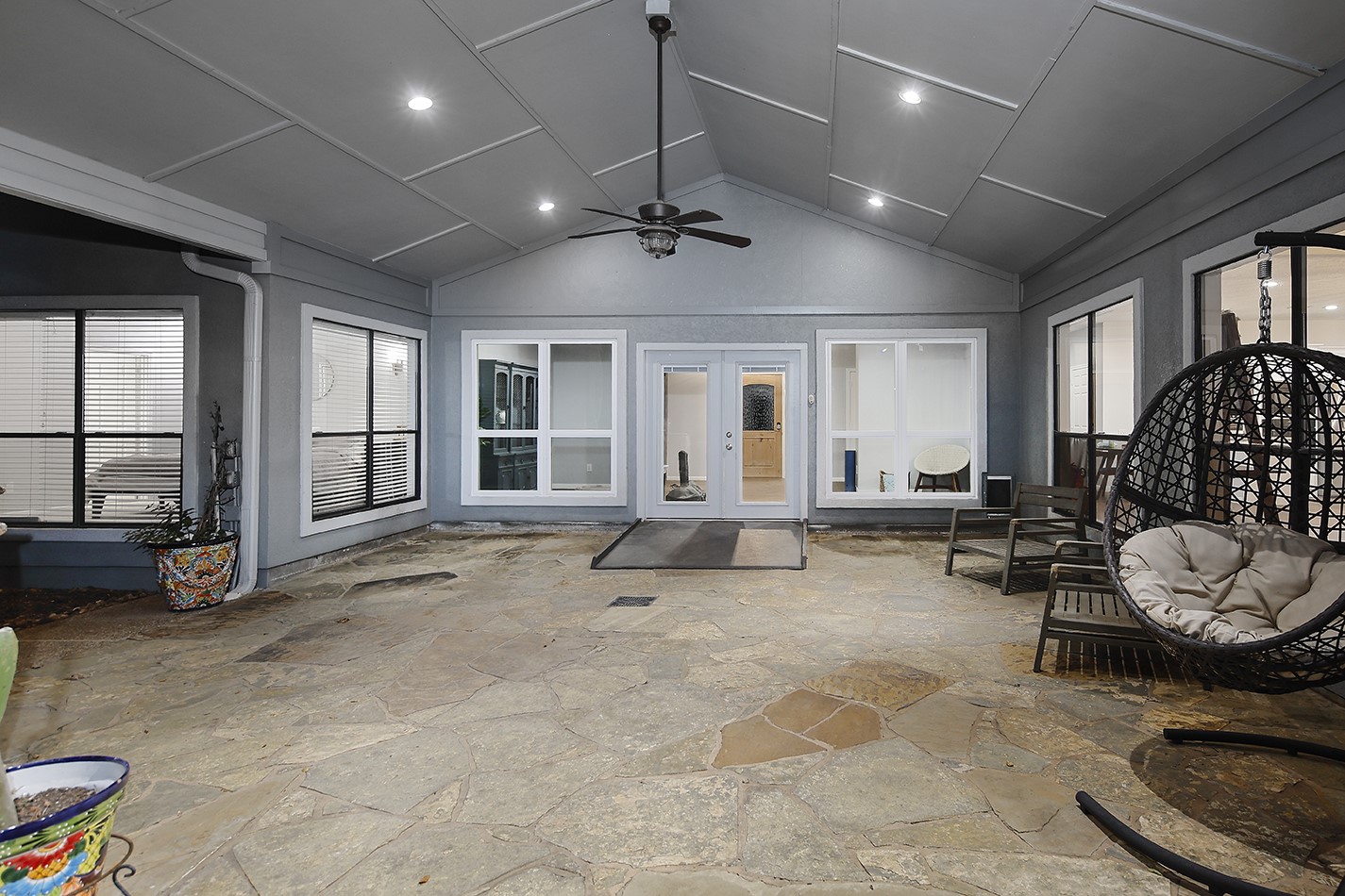 44 Lake Forest Circle Conroe, TX 77384 - Photo 43 of 45 a living room with furniture gym equipment and a large window