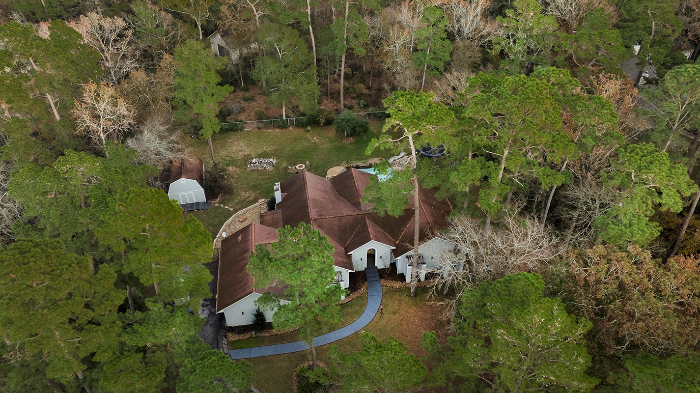 44 Lake Forest Circle Conroe, TX 77384 - Photo 45 of 45 an aerial view of a house with a yard