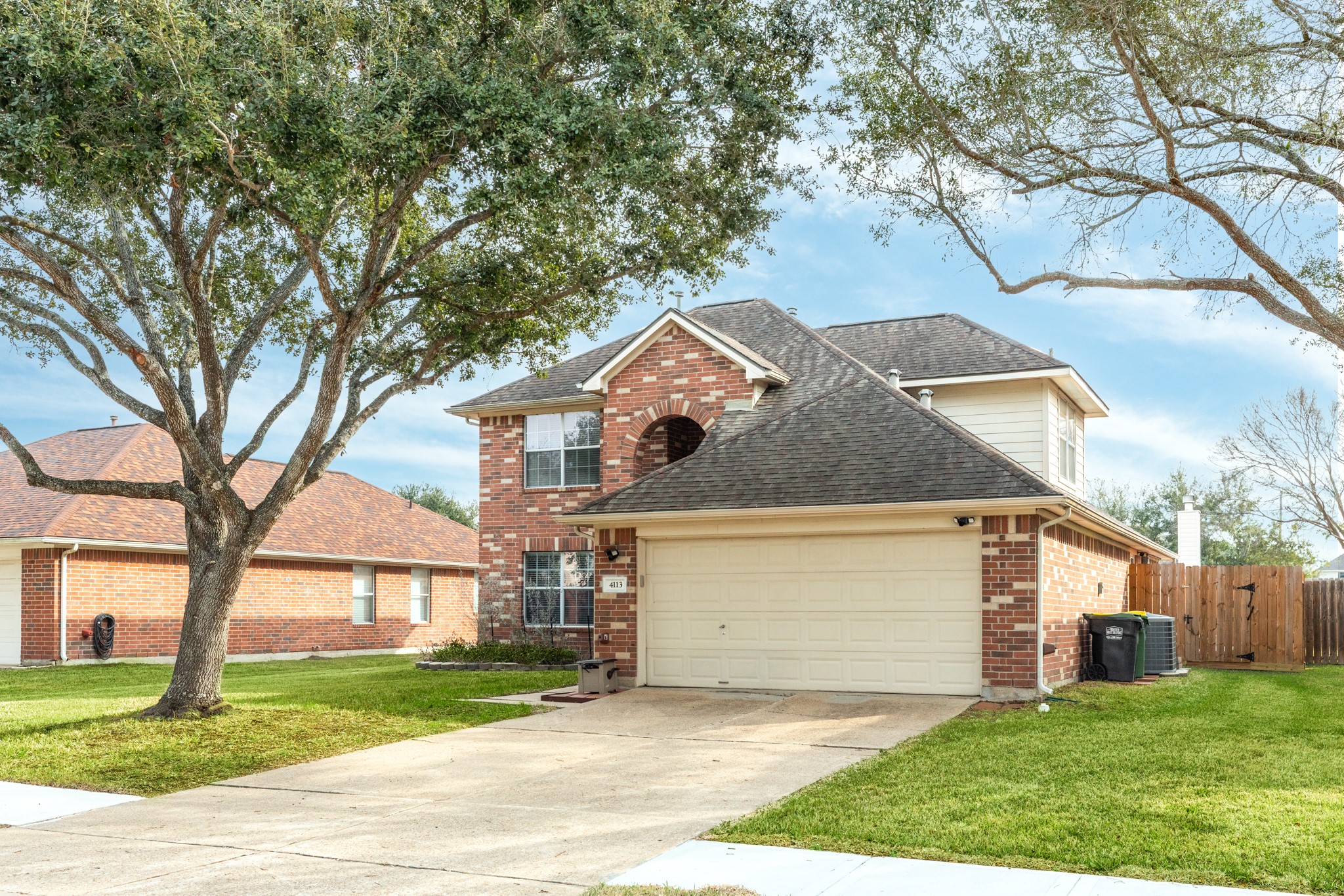 4113 Merlet Drive Pearland, TX 77584 - Photo 32 of 36 Another view of the front double driveway with large shade trees.