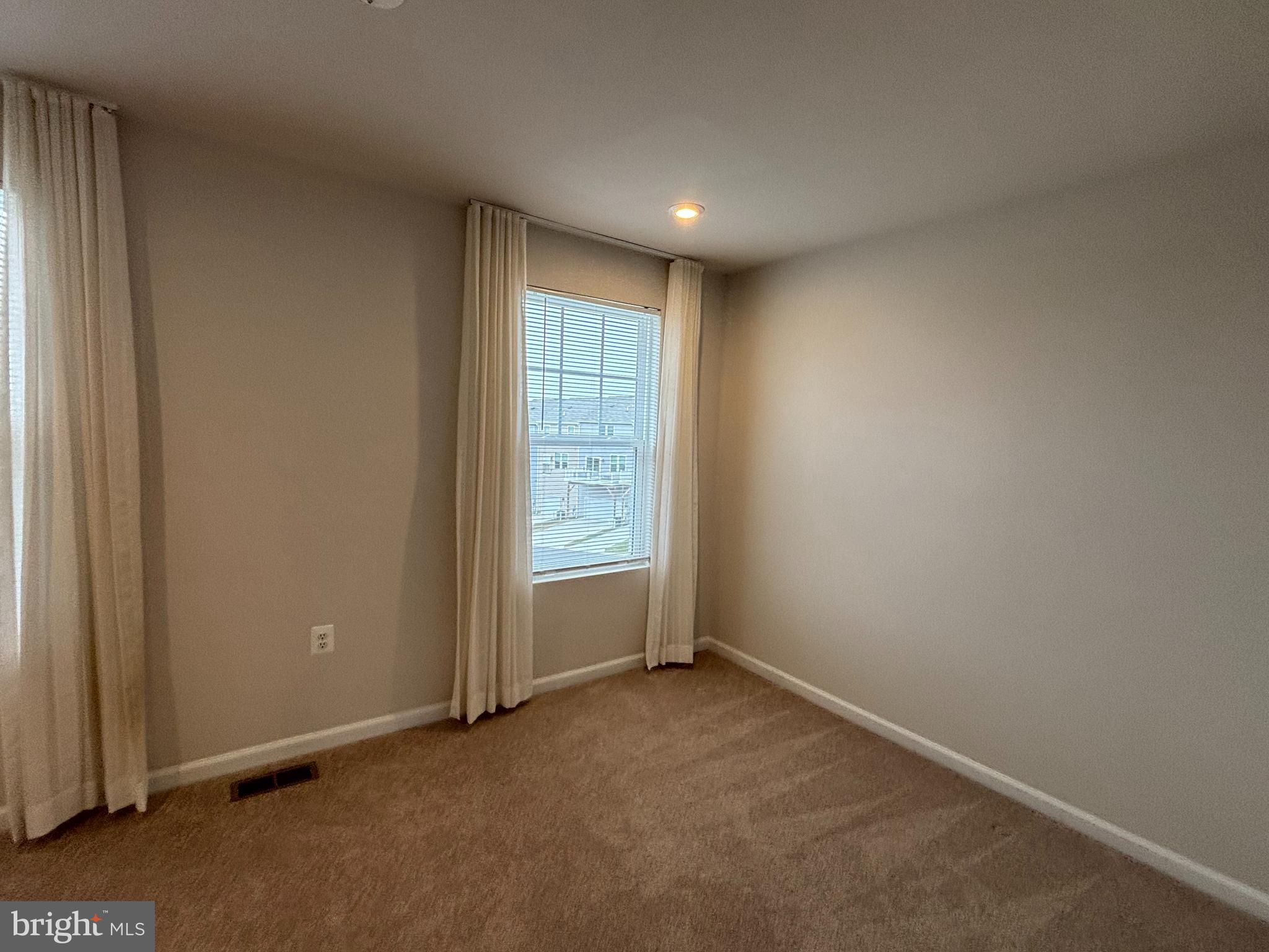 24 Anthem Street Ranson, WV 25438 - Photo 15 of 23 an empty room with windows
