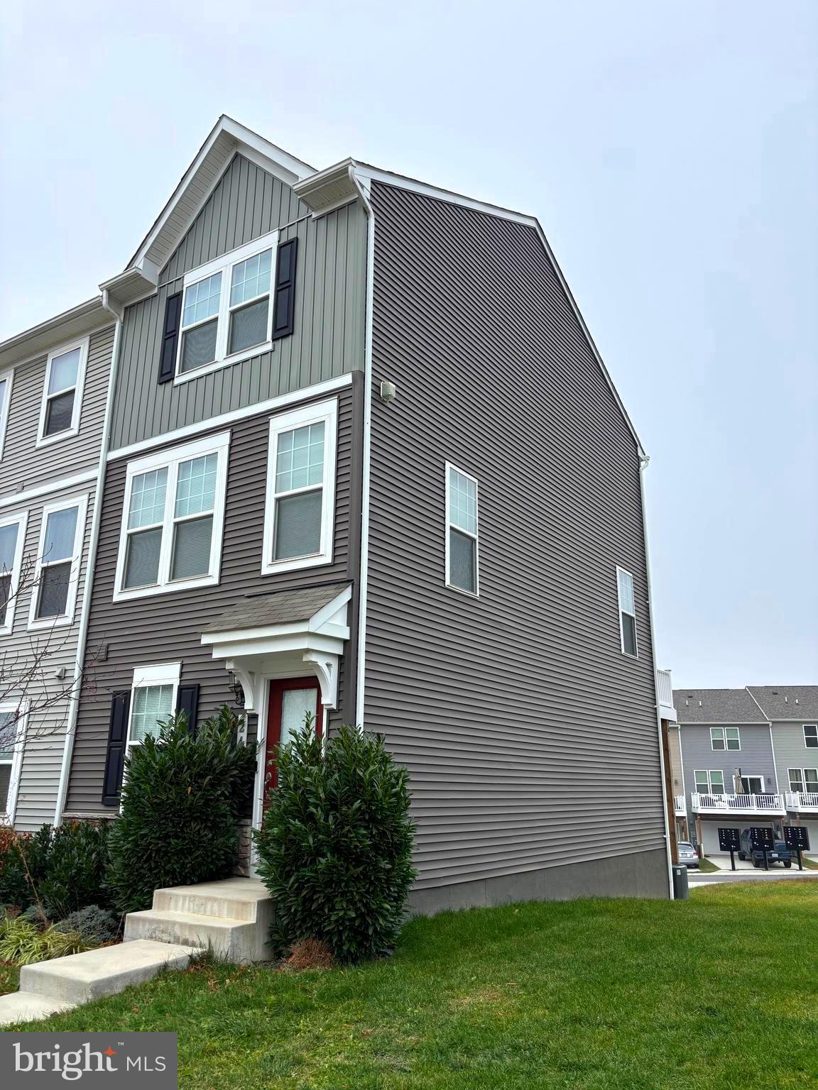 24 Anthem Street Ranson, WV 25438 - Photo 2 of 23 a front view of a house with a yard