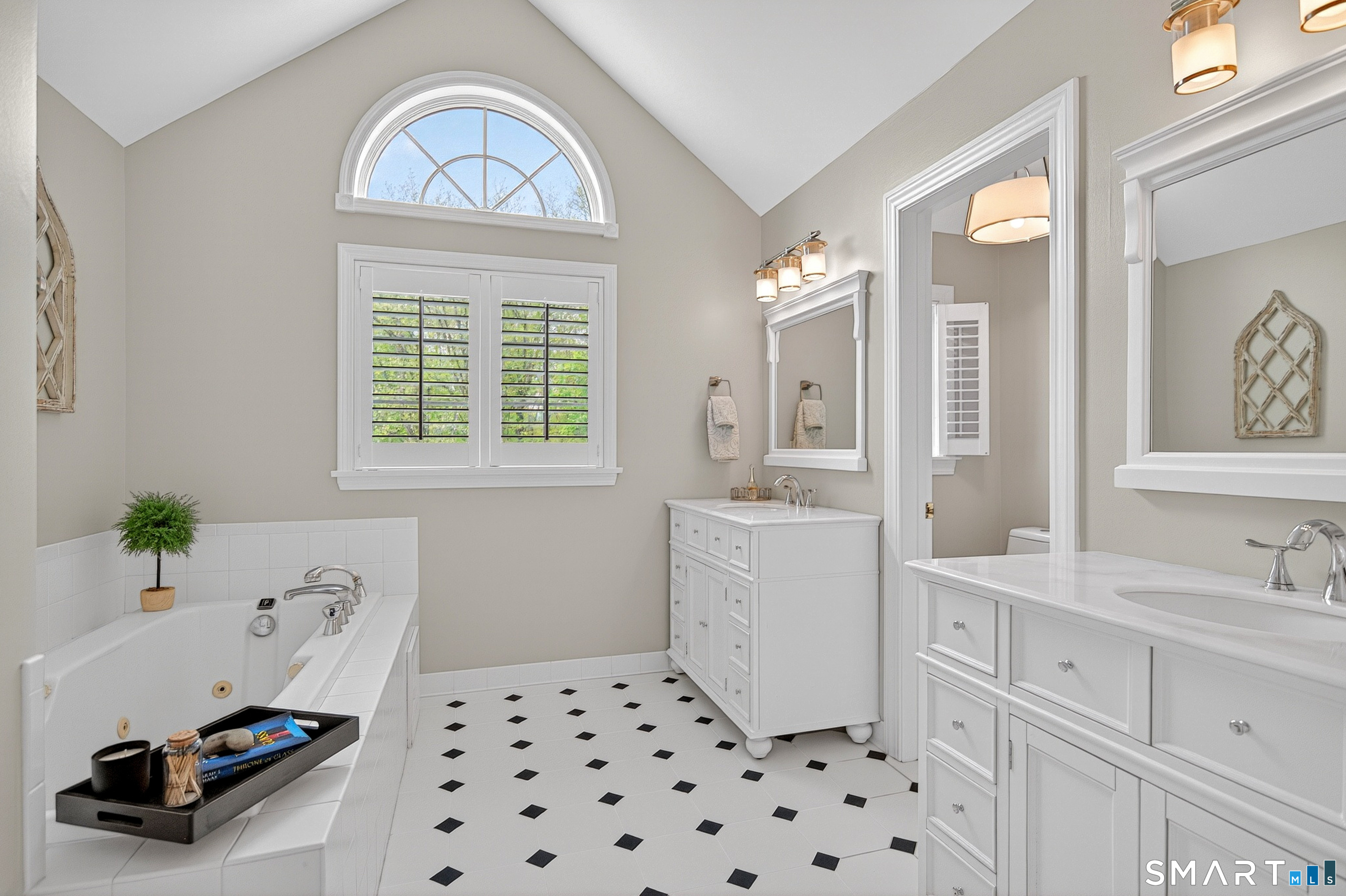 16 Farm Meadow Road Newtown, CT 06470 - Photo 19 of 40 a room with a sink a chandelier and a mirror