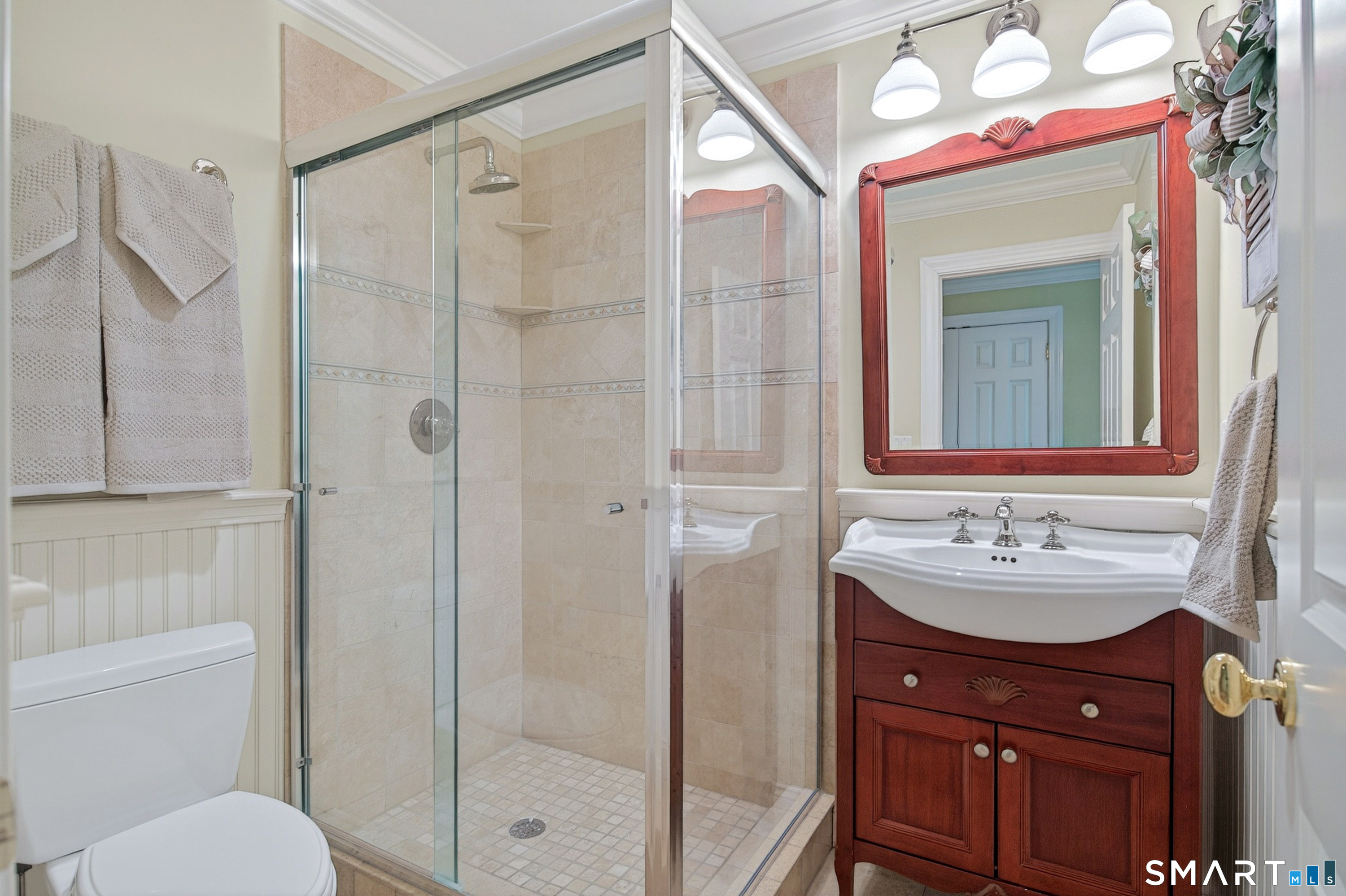 16 Farm Meadow Road Newtown, CT 06470 - Photo 27 of 40 a bathroom with a sink vanity mirror and toilet