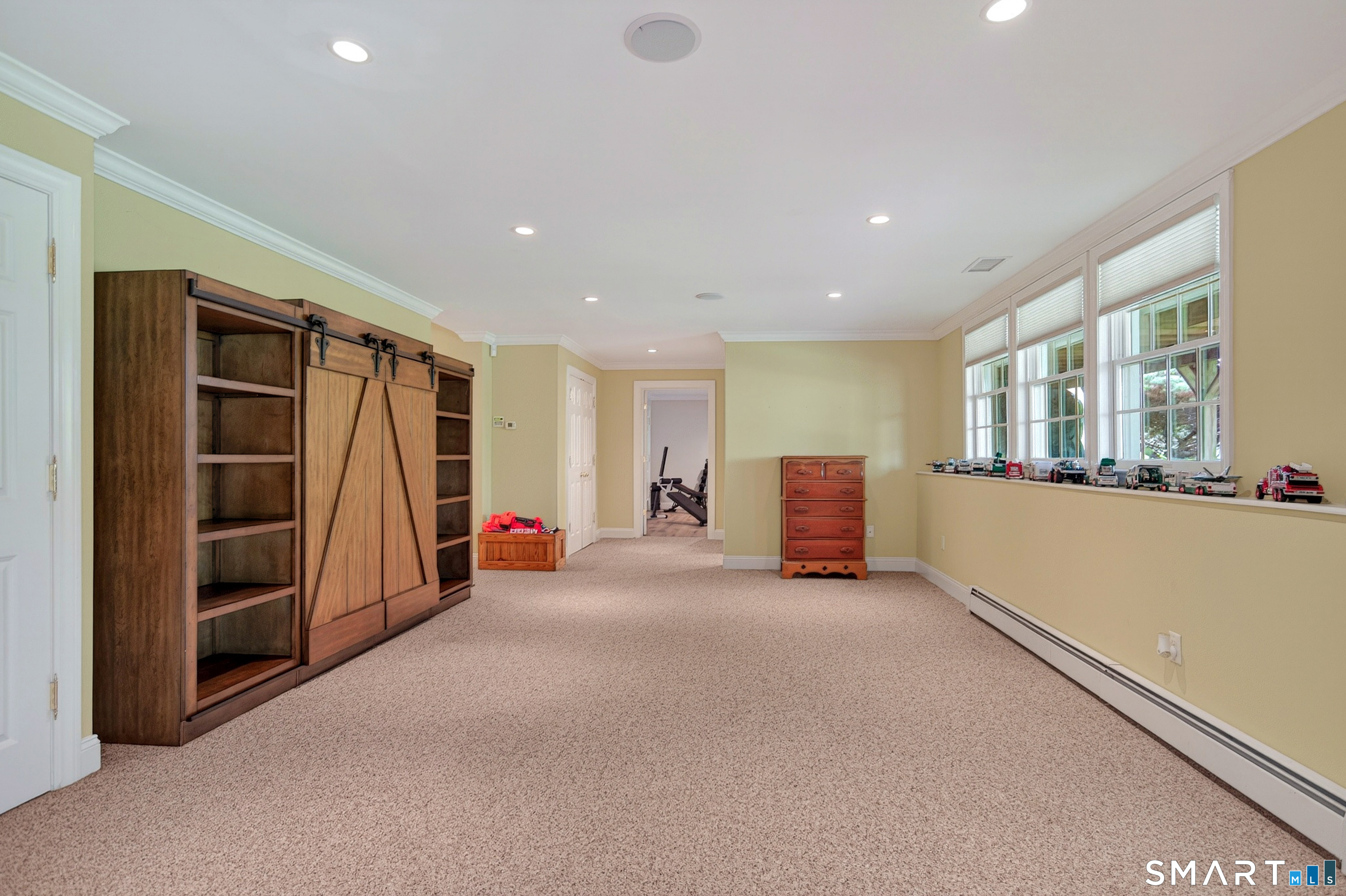 16 Farm Meadow Road Newtown, CT 06470 - Photo 28 of 40 a view of a livingroom with walk in closet and bedroom