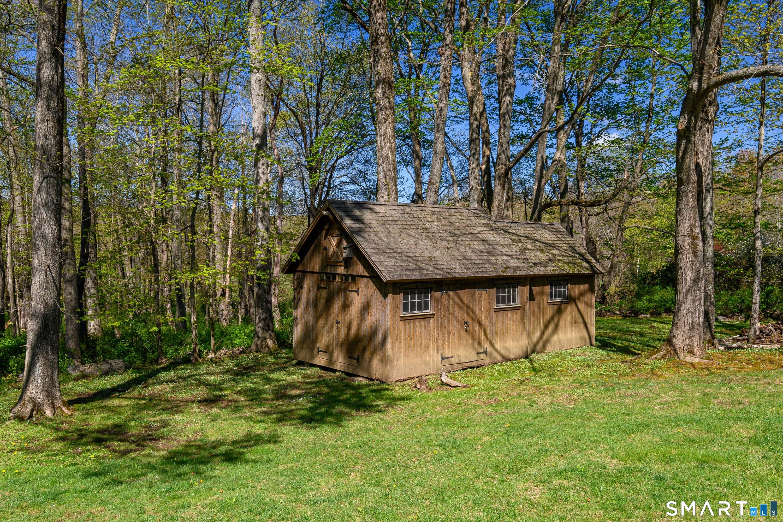 16 Farm Meadow Road Newtown, CT 06470 - Photo 35 of 40 a view of a backyard with a tree