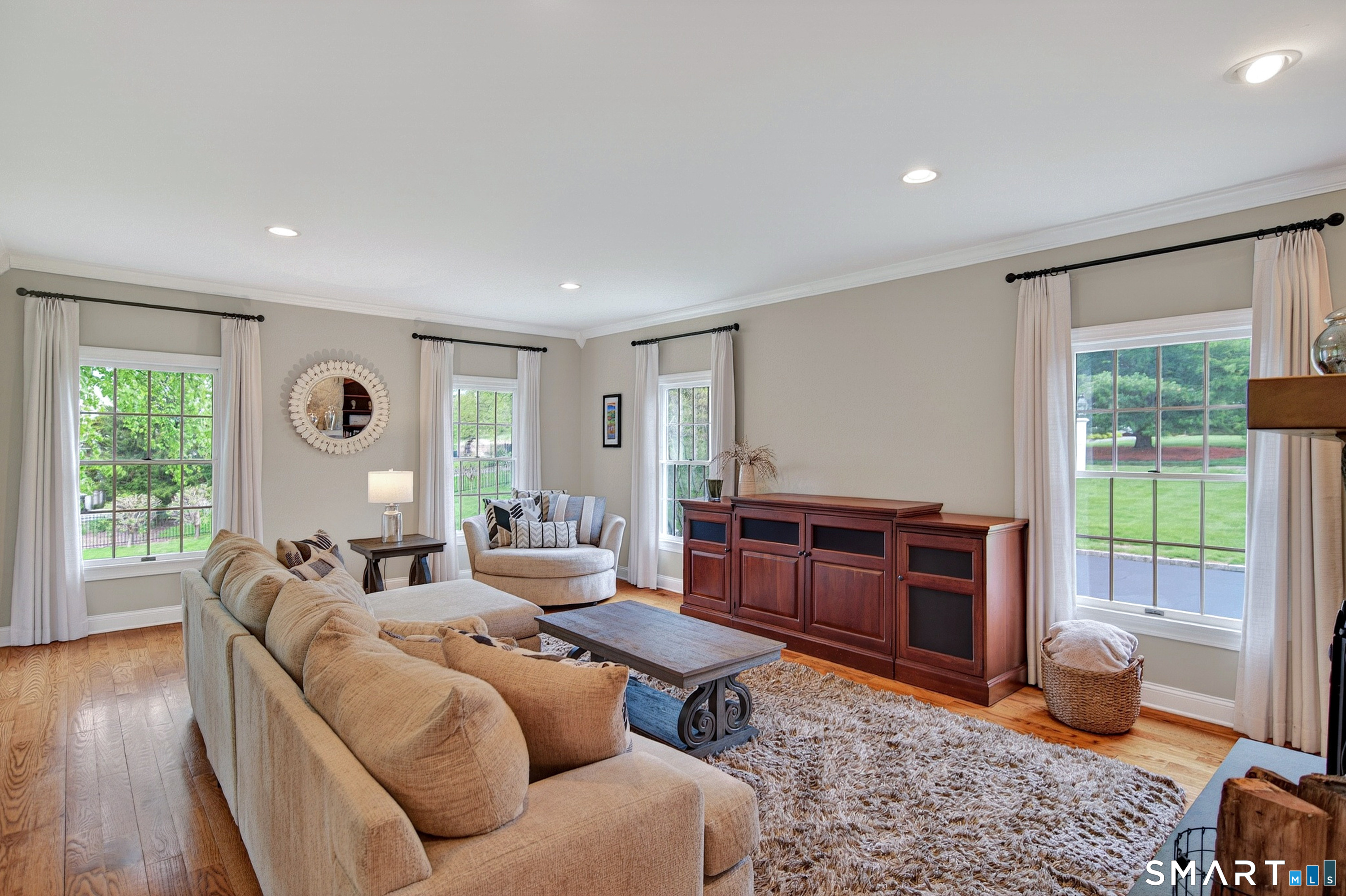 16 Farm Meadow Road Newtown, CT 06470 - Photo 9 of 40 a living room with furniture a window and a table