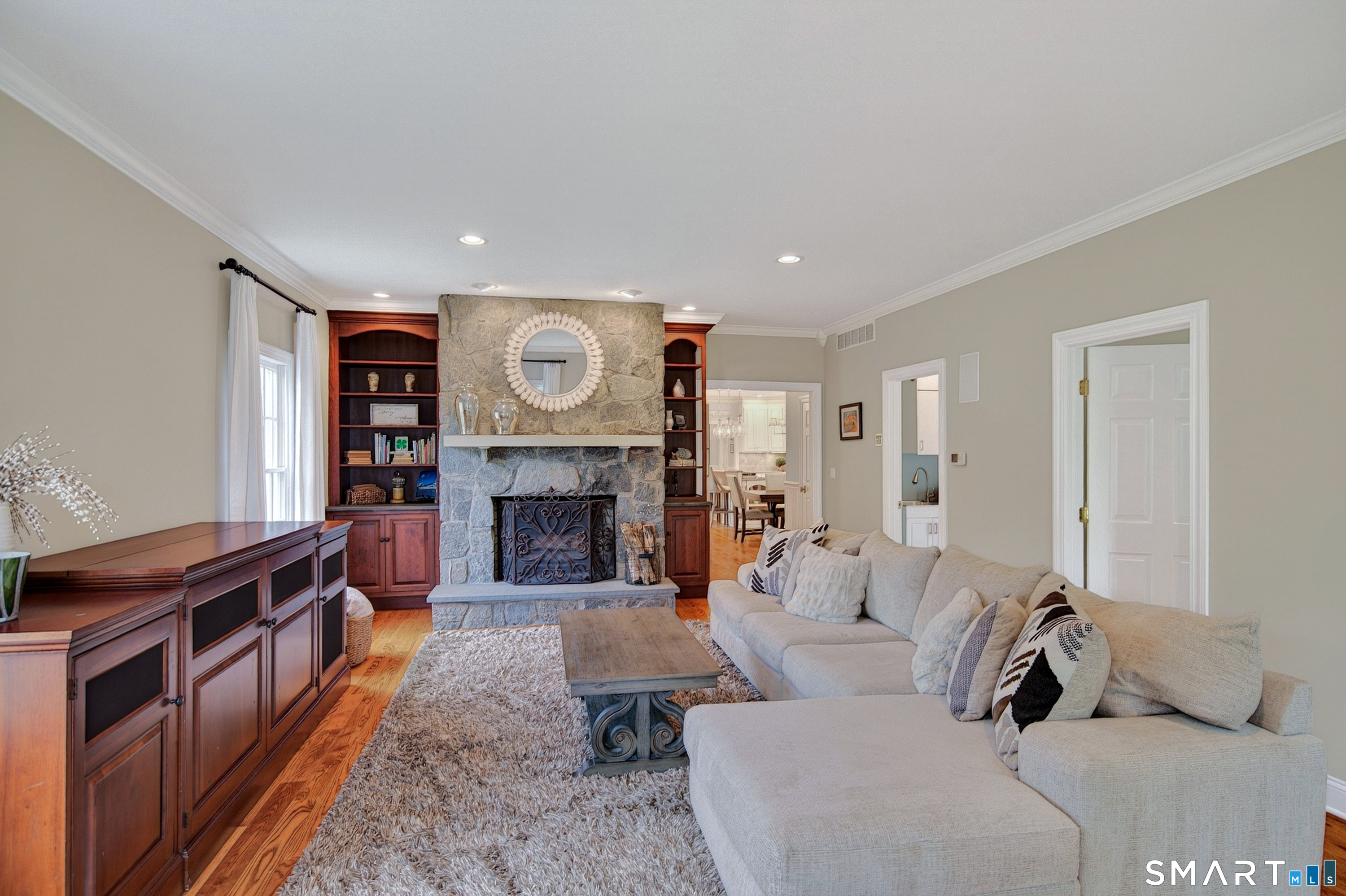 16 Farm Meadow Road Newtown, CT 06470 - Photo 10 of 40 a living room with furniture and a fireplace