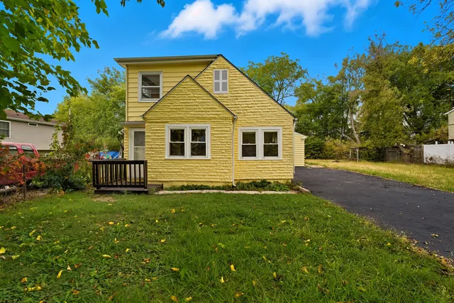 a front view of a house with yard