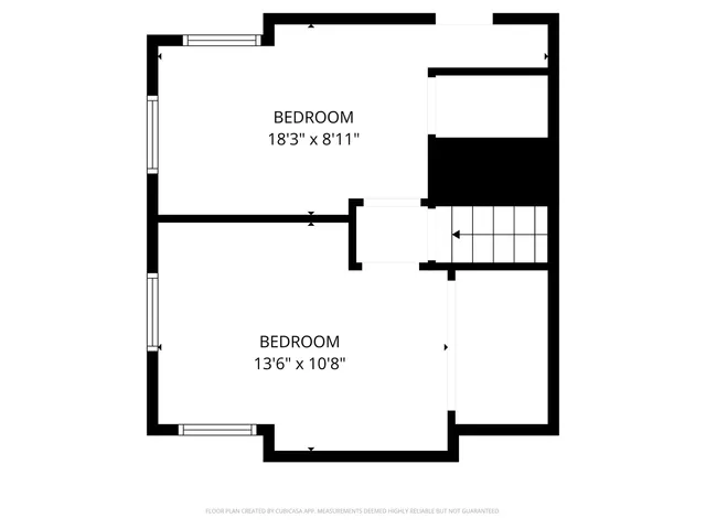 a picture of a bench in front of a wall