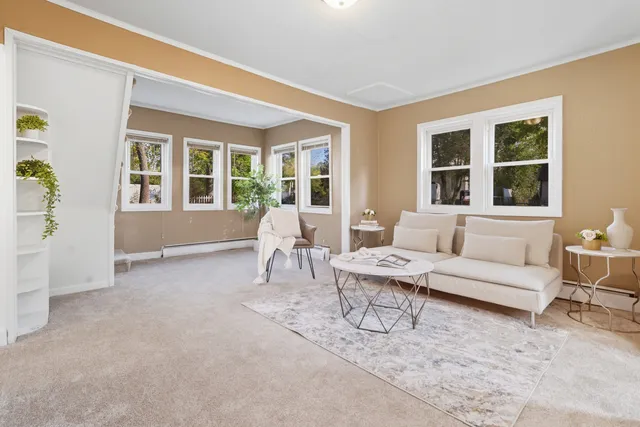 a living room with furniture and windows