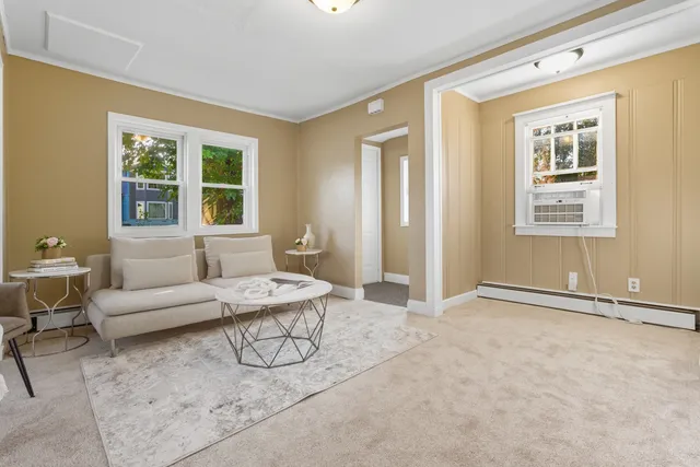 a living room with furniture and a window
