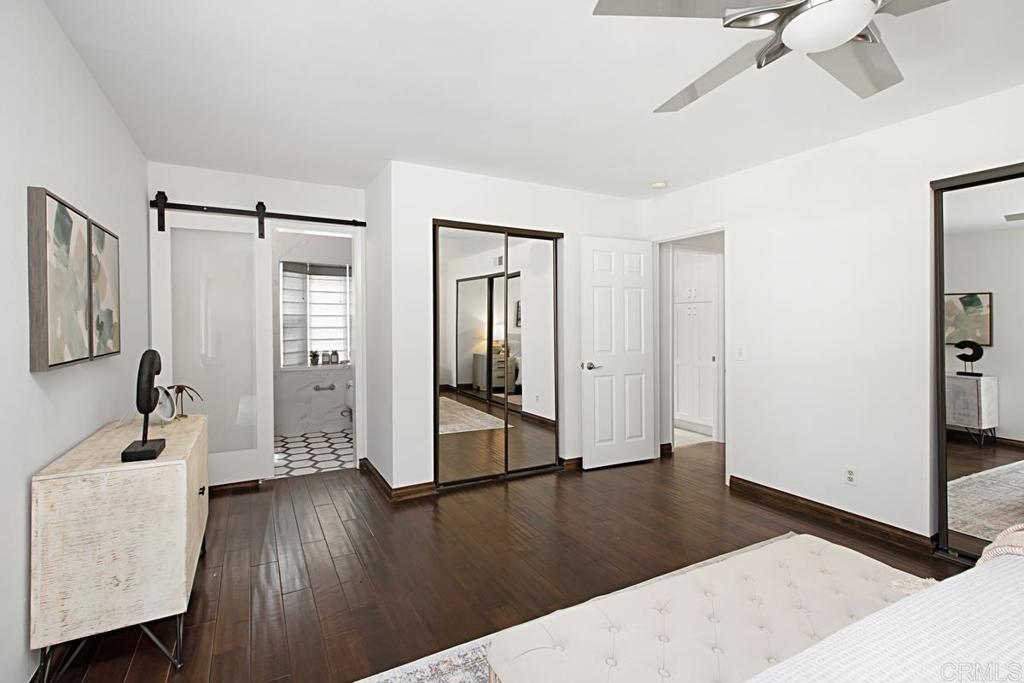 1671 James Drive Carlsbad, CA 92008 - Photo 25 of 41 a living room with hardwood floor and a ceiling fan