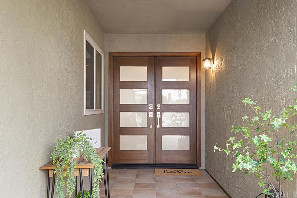 1671 James Drive Carlsbad, CA 92008 - Photo 6 of 41 a potted plant sitting in front of a house