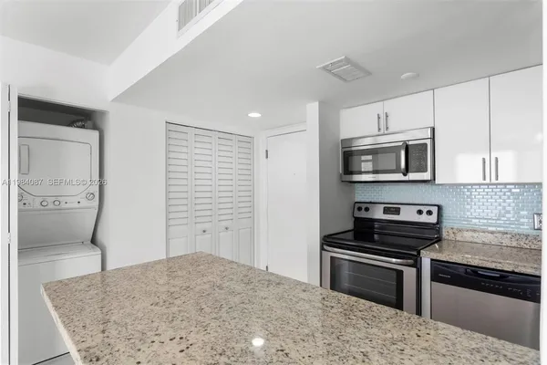 a kitchen with a stove and a microwave