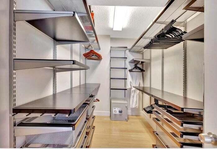 4200 North Ocean Drive, Unit 1905 Singer Island, FL 33404 - Photo 12 of 38 a view of staircase and living room with wooden floor