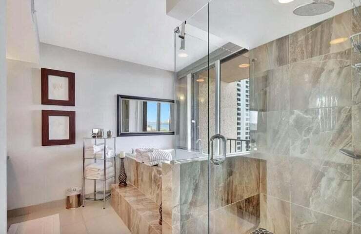 4200 North Ocean Drive, Unit 1905 Singer Island, FL 33404 - Photo 13 of 38 a spacious bathroom with a double vanity sink a mirror and shower