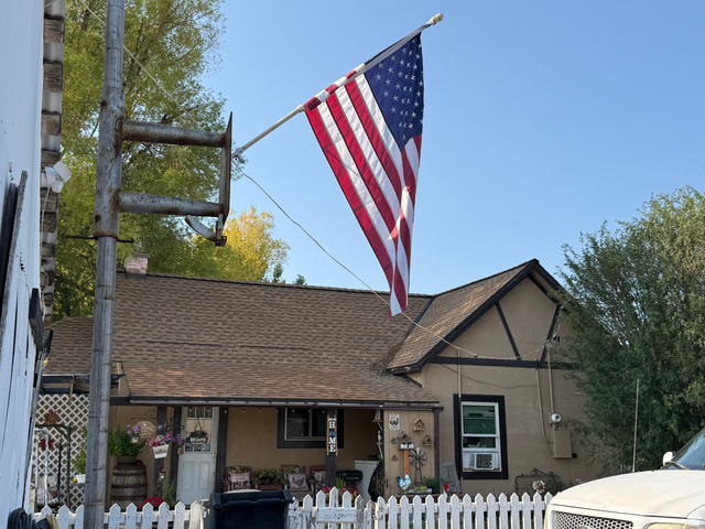 379 Main Street Georgetown, ID 83239 - Photo 1 of 23 Tudor Revival architectural style home featuring a gabled roof with brown shingles, tan stucco exterior, and dark brown trim details