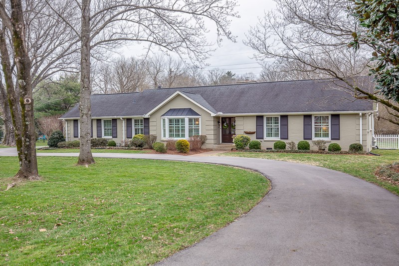 5911 Post Road Nashville, TN 37205 - Photo 1 of 38 a front view of a house with a yard