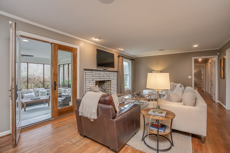 5911 Post Road Nashville, TN 37205 - Photo 12 of 38 a living room with furniture a fireplace and a flat screen tv