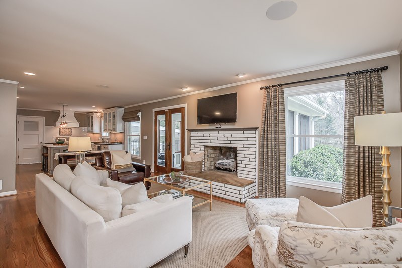 5911 Post Road Nashville, TN 37205 - Photo 14 of 38 a living room with furniture a fireplace and a large window
