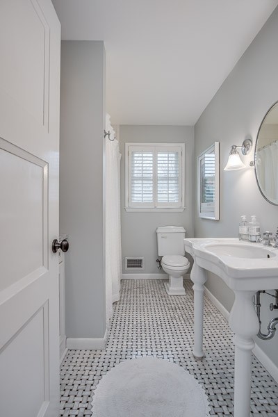 5911 Post Road Nashville, TN 37205 - Photo 15 of 38 a bathroom with a sink toilet and shower