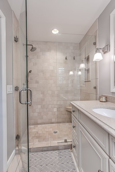 5911 Post Road Nashville, TN 37205 - Photo 22 of 38 a bathroom with a shower sink and mirror