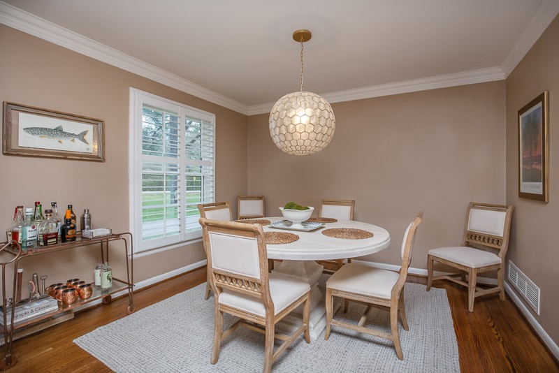 5911 Post Road Nashville, TN 37205 - Photo 6 of 38 a dining room with furniture a rug and a chandelier