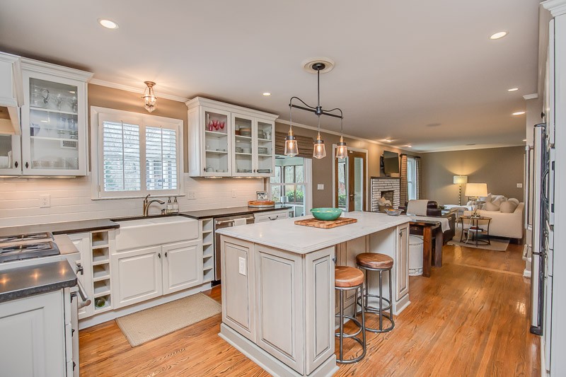 5911 Post Road Nashville, TN 37205 - Photo 8 of 38 a kitchen with stainless steel appliances granite countertop a stove and a wooden floors