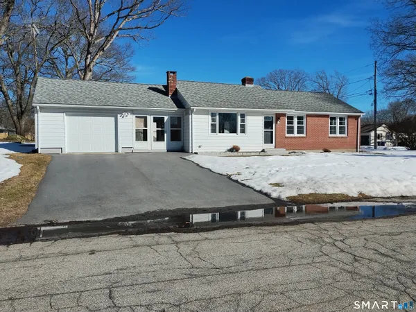 a front view of a house with yard