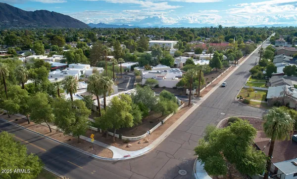 a view of a room with a wooden floor and a window
