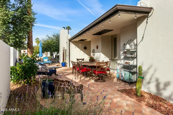 a view of outdoor space with table and chairs