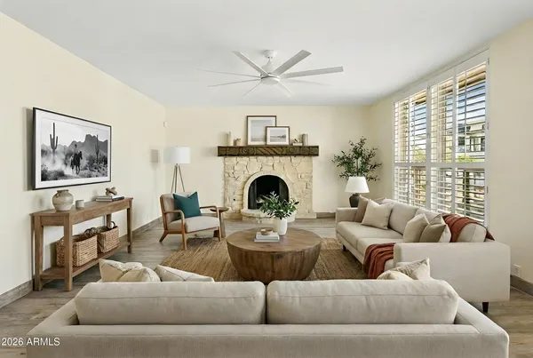 a living room with furniture and a fireplace