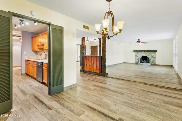 a kitchen with wooden cabinets and a stove top oven
