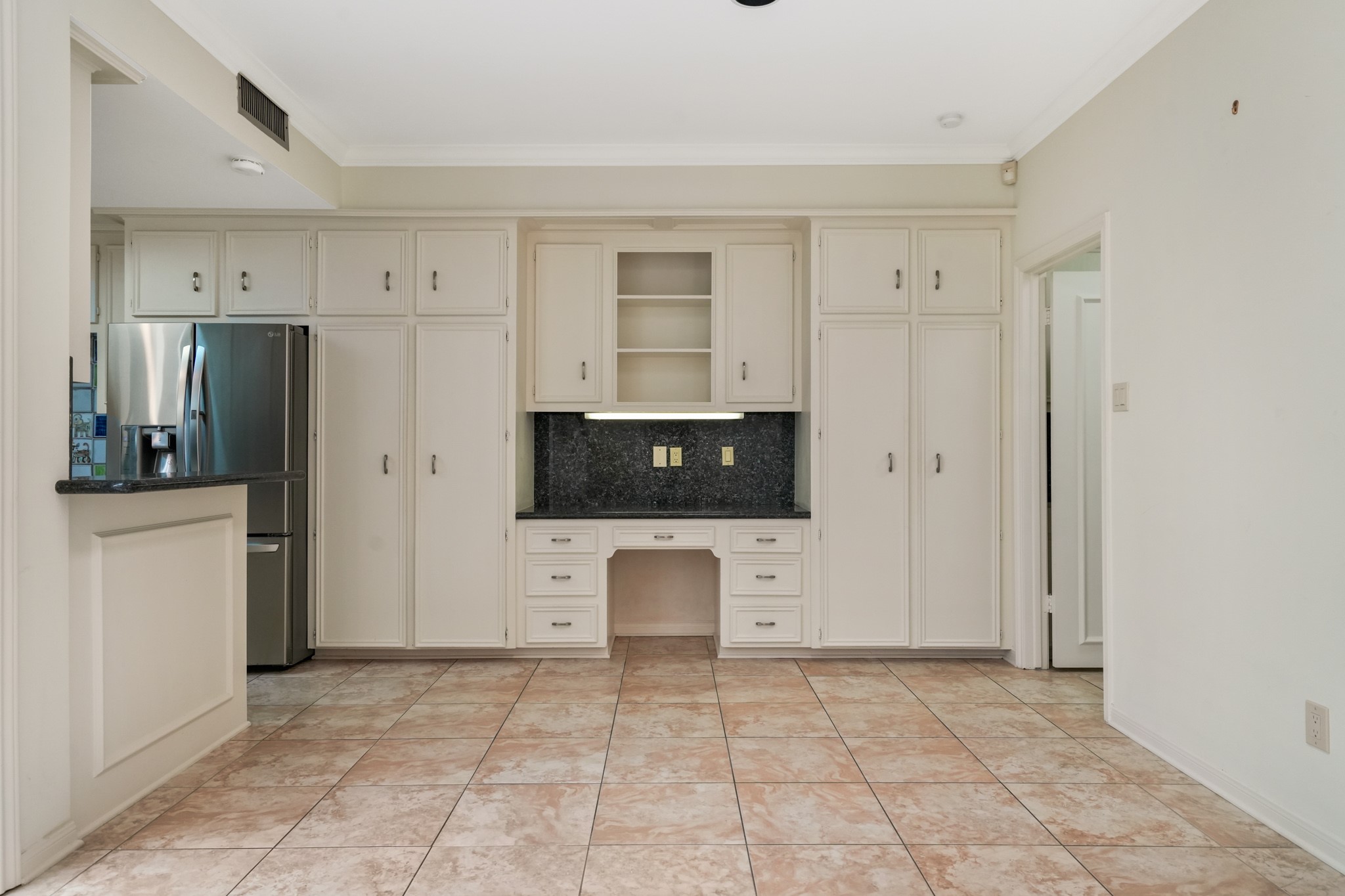 201 Vanderpool Lane, Unit 65 Houston, TX 77024 - Photo 11 of 34 a view of kitchen with stainless steel appliances granite countertop a refrigerator and a stove top oven