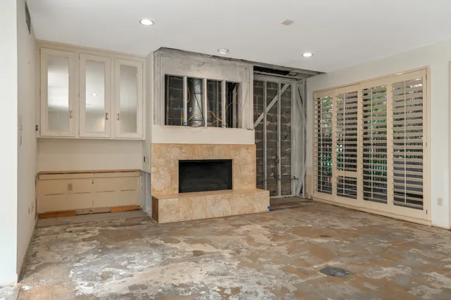 a view of an empty room with a balcony