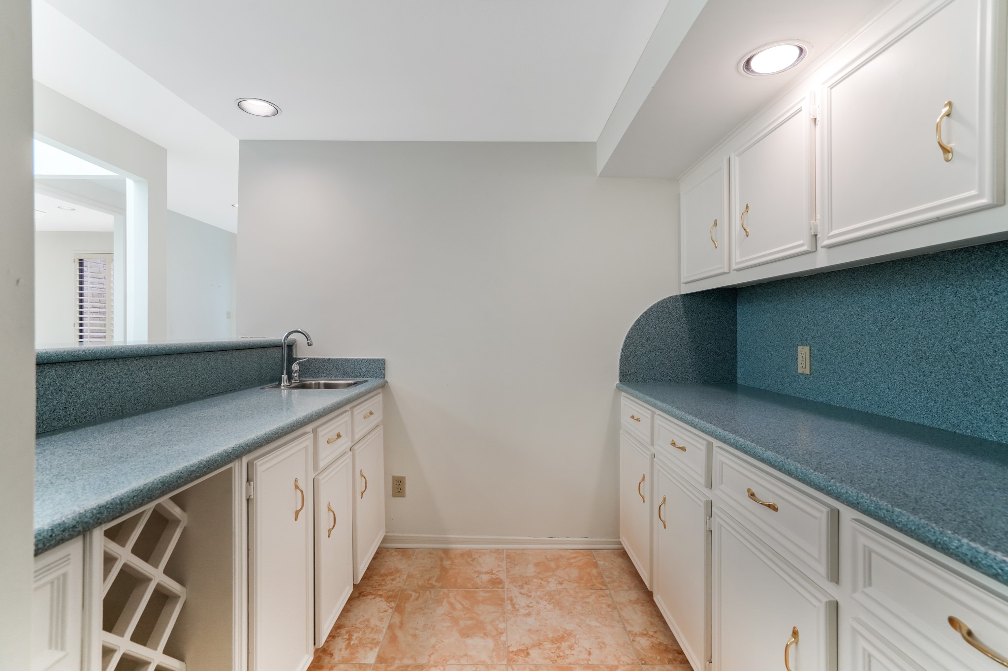 201 Vanderpool Lane, Unit 65 Houston, TX 77024 - Photo 21 of 34 a kitchen with white cabinets and a sink