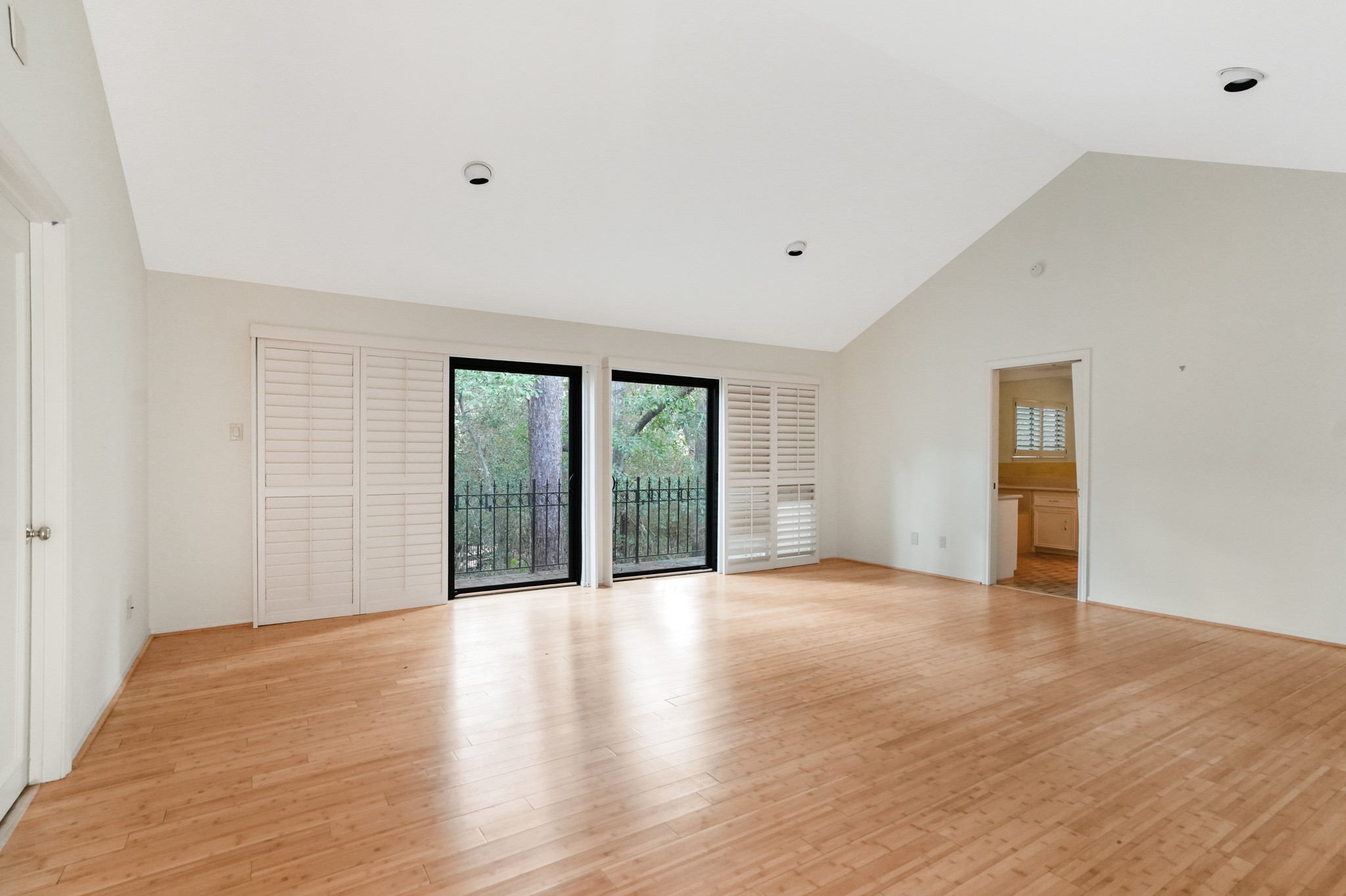 201 Vanderpool Lane, Unit 65 Houston, TX 77024 - Photo 23 of 34 a view of an empty room with wooden floor and a window