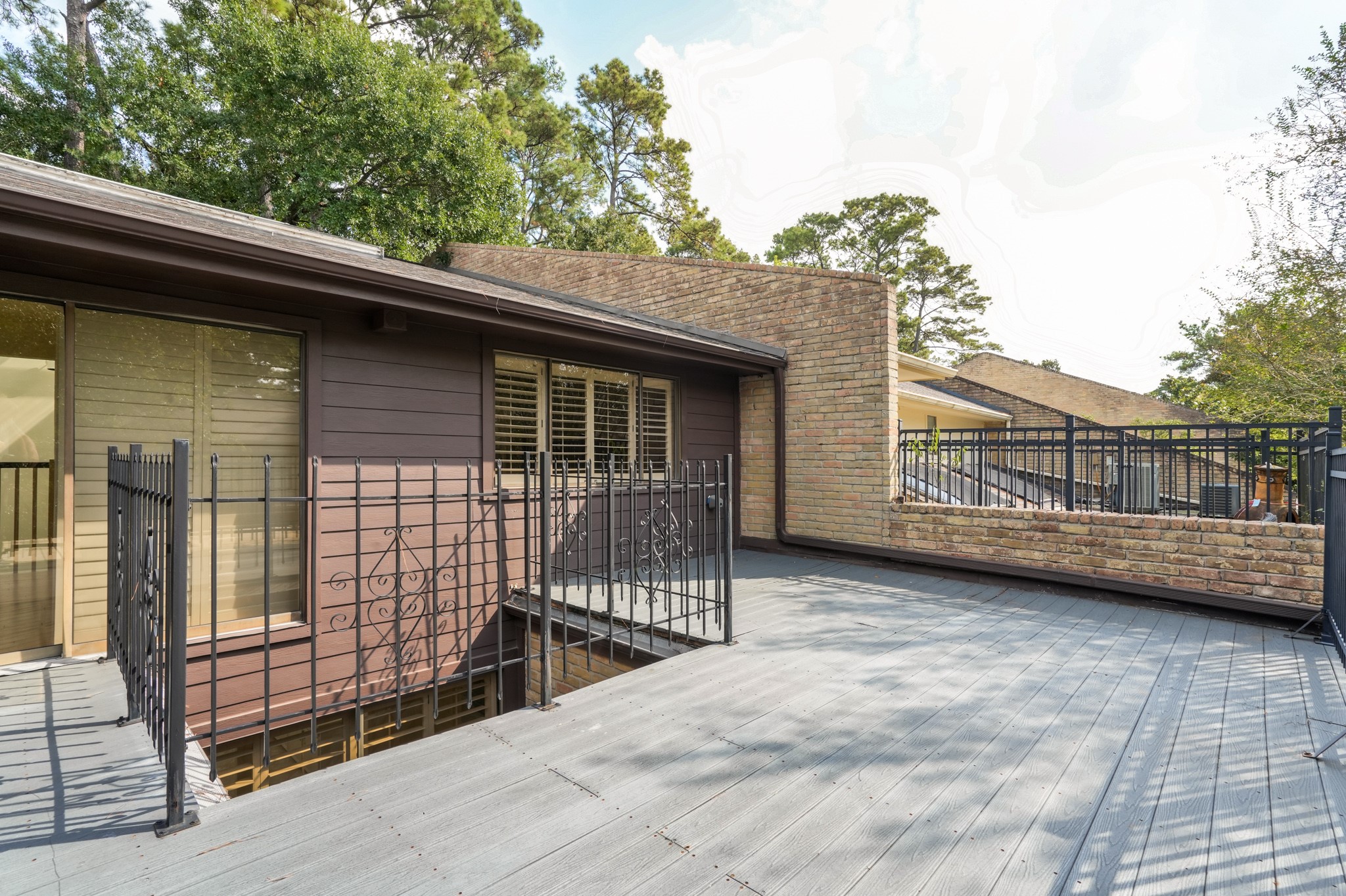 201 Vanderpool Lane, Unit 65 Houston, TX 77024 - Photo 28 of 34 a view of a house with a balcony