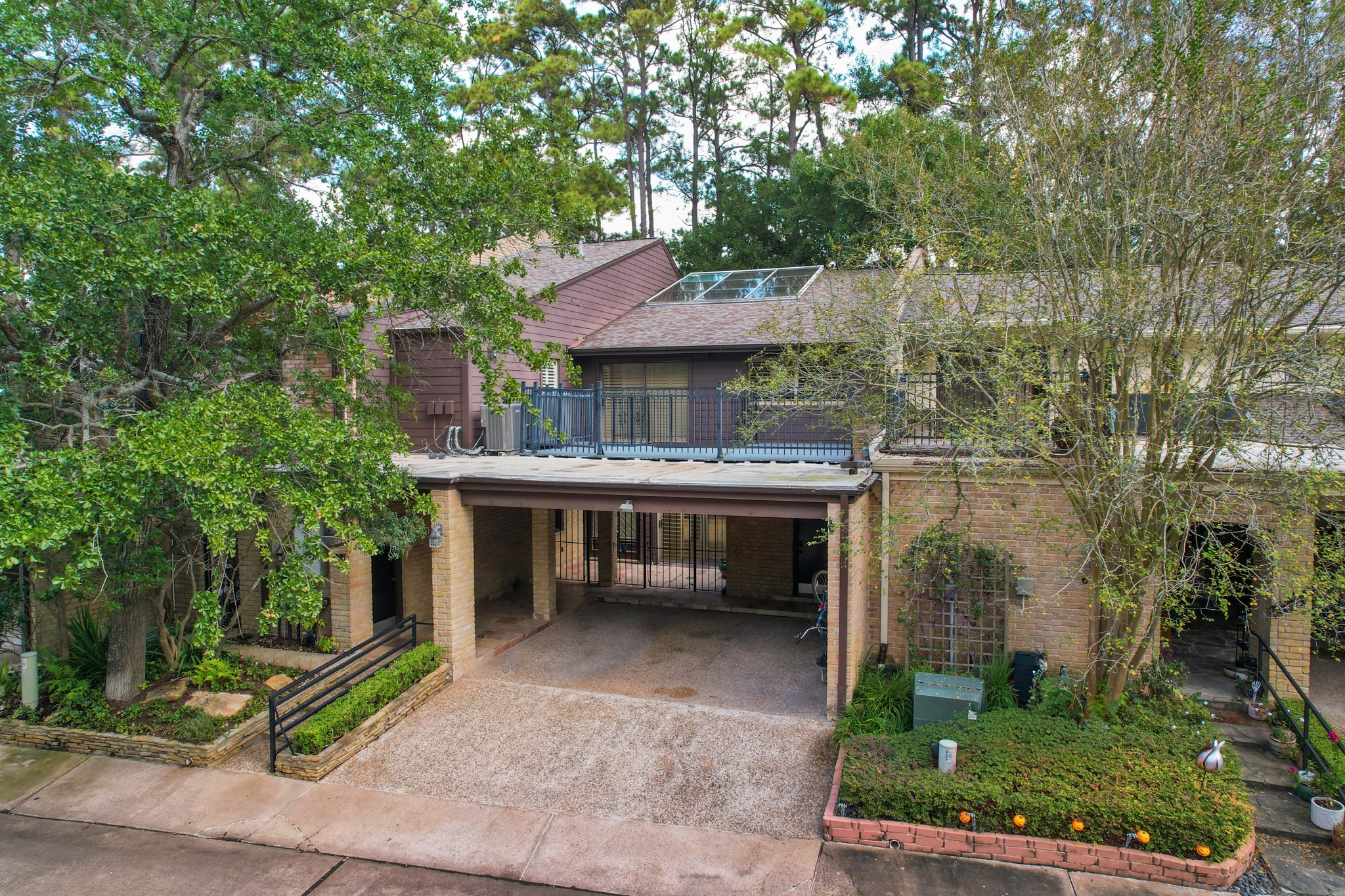 201 Vanderpool Lane, Unit 65 Houston, TX 77024 - Photo 34 of 34 a view of a patio with table and chairs with wooden floor and fence