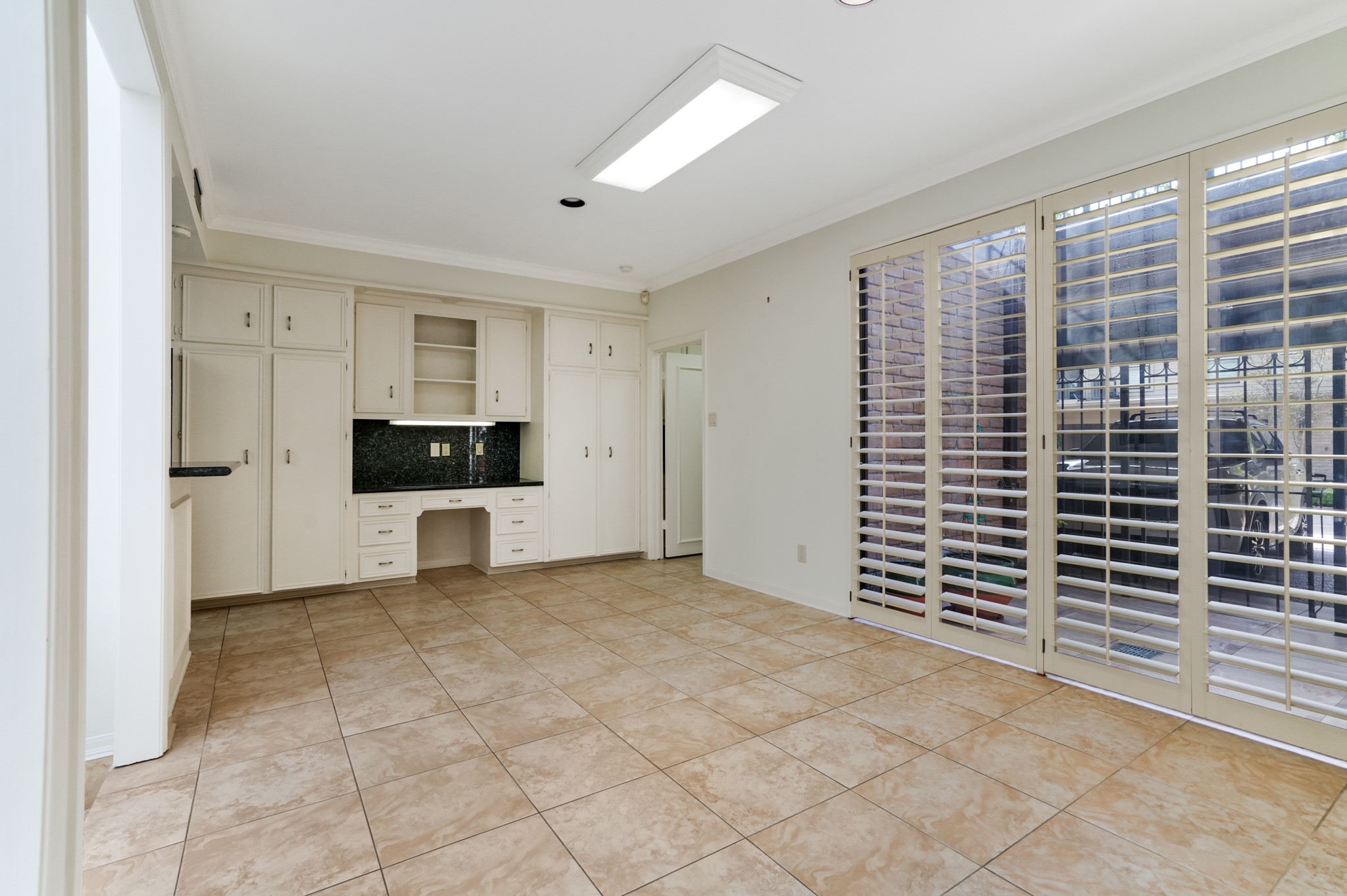 201 Vanderpool Lane, Unit 65 Houston, TX 77024 - Photo 10 of 34 a view of livingroom with an empty space and a kitchen
