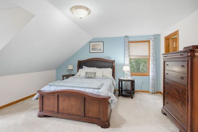 a bedroom with a bed and a tv