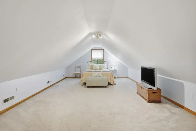 a bedroom with furniture and a bed