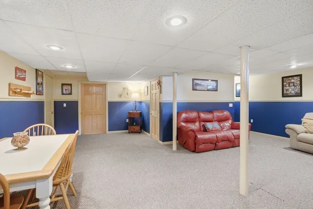 a bedroom with furniture and a book shelf