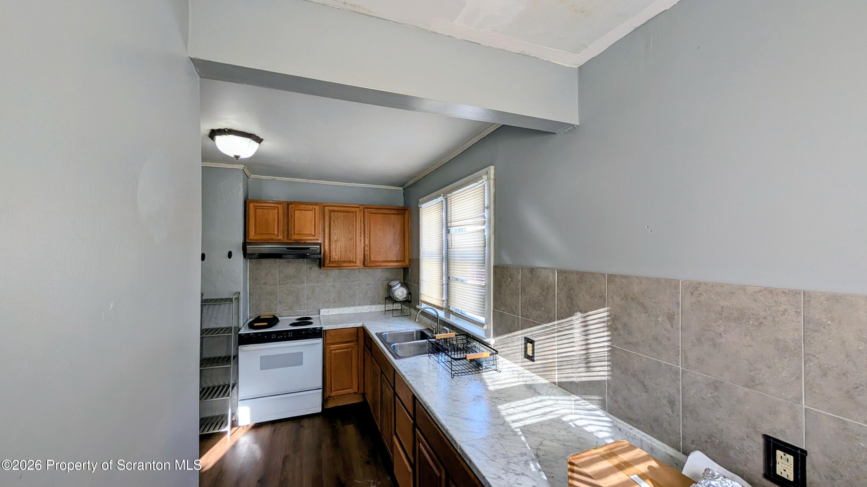 509 Main Street Duryea, PA 18642 - Photo 10 of 30 a kitchen with a large window appliances and cabinets