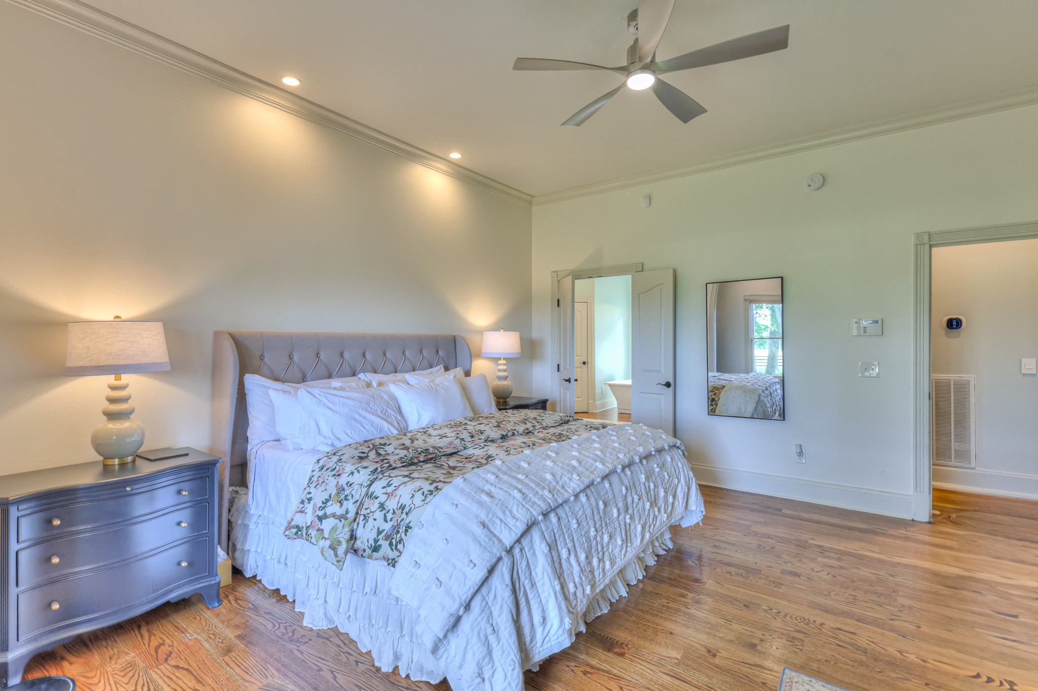 4288 Central Valley Road Murfreesboro, TN 37129 - Photo 34 of 77 a bedroom with a bed and a lamp on dresser