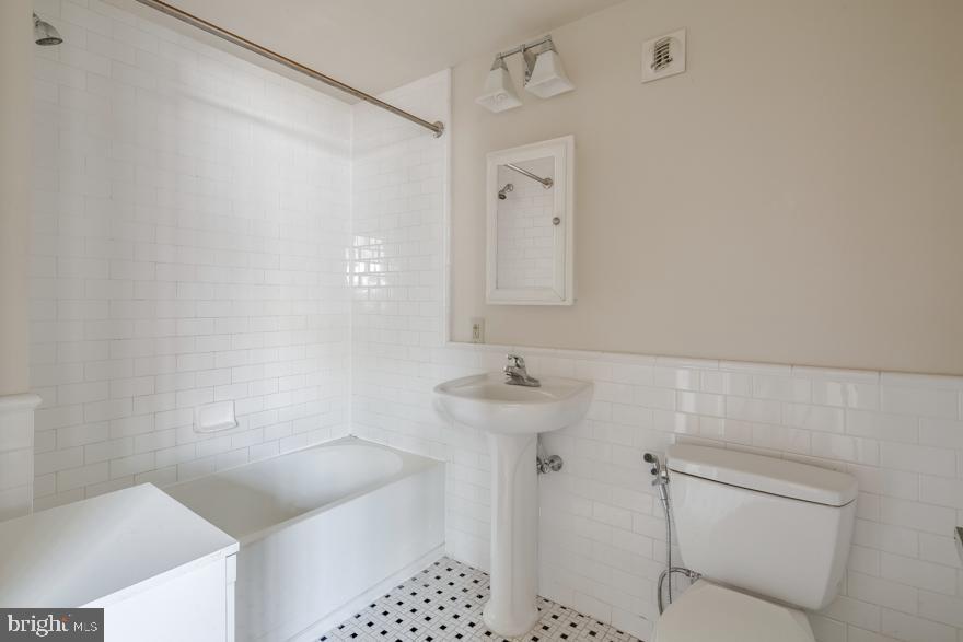 412 South 13th Street, Unit 208 Philadelphia, PA 19147 - Photo 5 of 10 a bathroom with a bathtub and shower